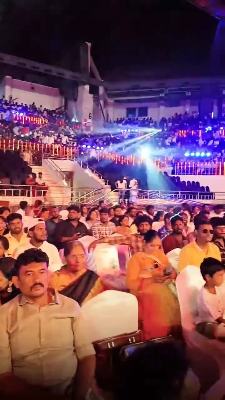 Crowd entering an arena through scanned entry gates