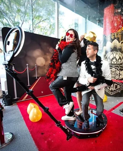 Guests on a 360 degree video booth platform